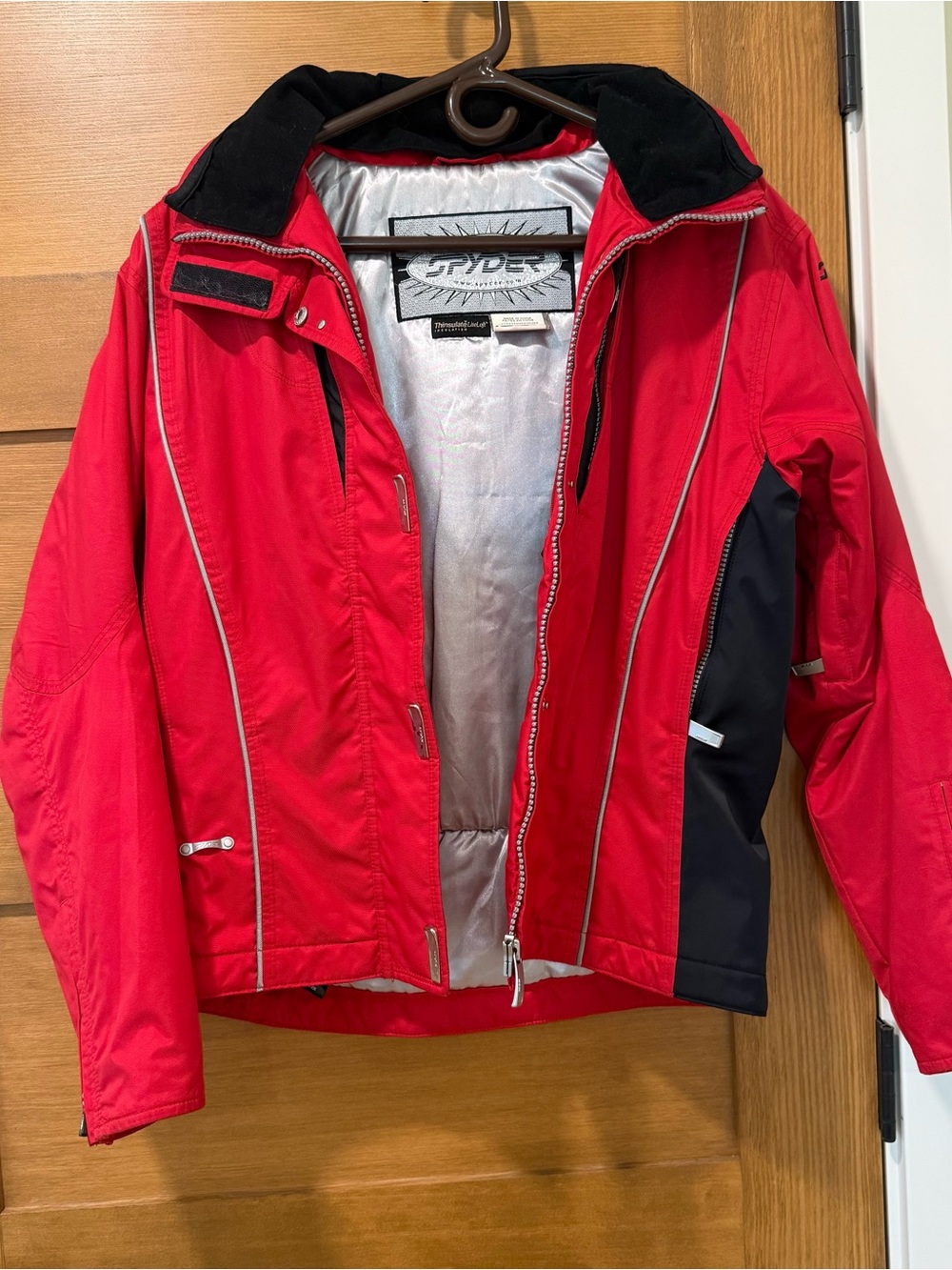 Spyder red ski/snowboard jacket with black panels, size 8